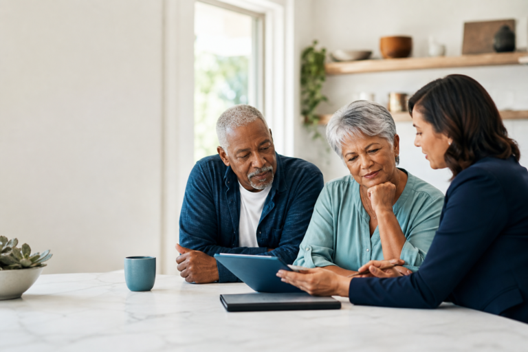 Couple turning 65 reviewing Medicare Advantage options with an advisor